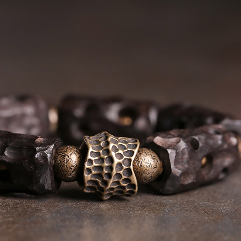 Pulsera de calma con Buddha Stones, madera de ébano, cobre y latón