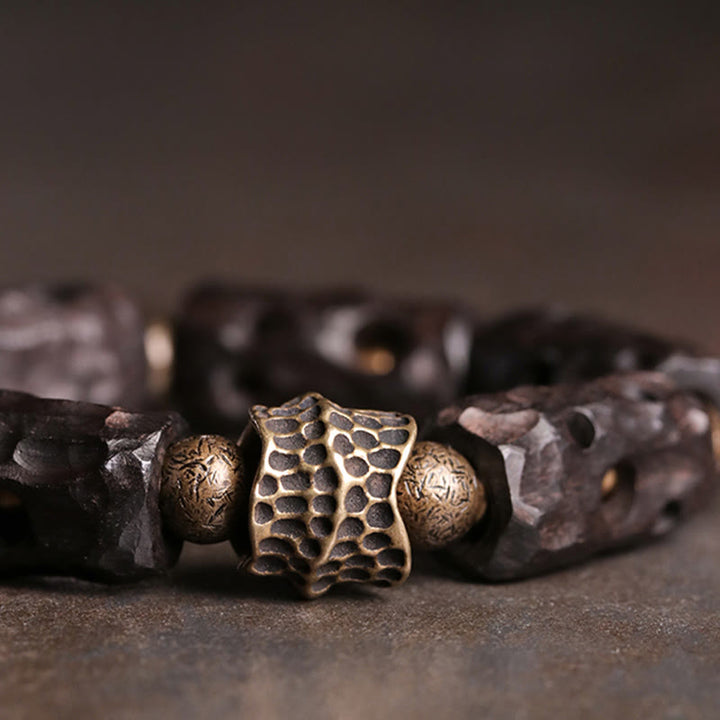 Pulsera de calma con Buddha Stones, madera de ébano, cobre y latón