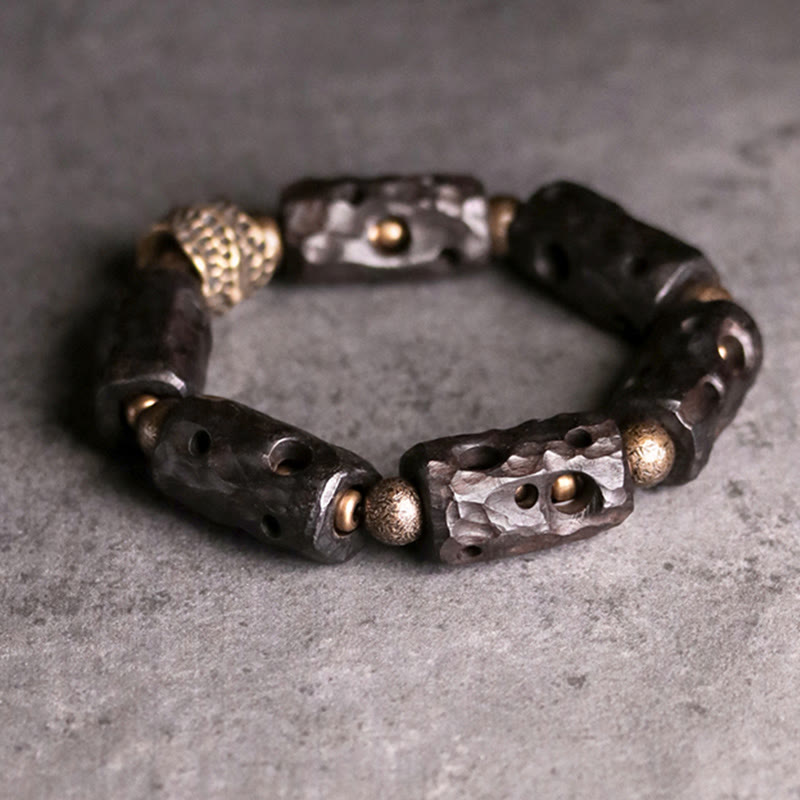 Pulsera de calma con Buddha Stones, madera de ébano, cobre y latón