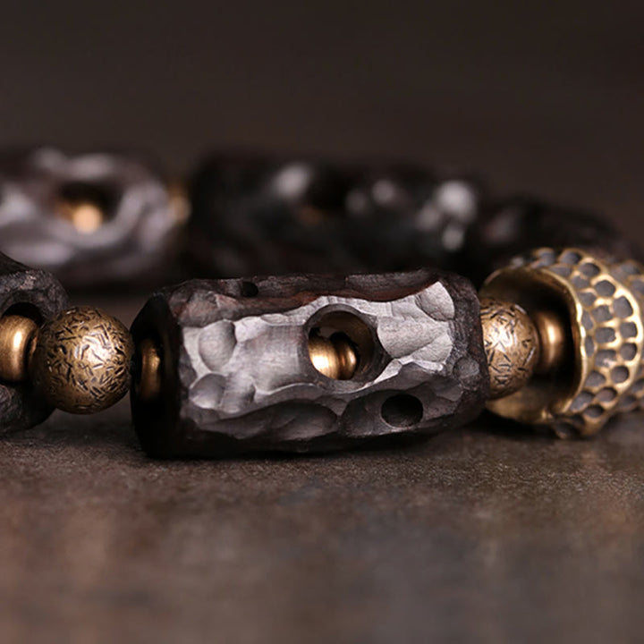 Pulsera de calma con Buddha Stones, madera de ébano, cobre y latón