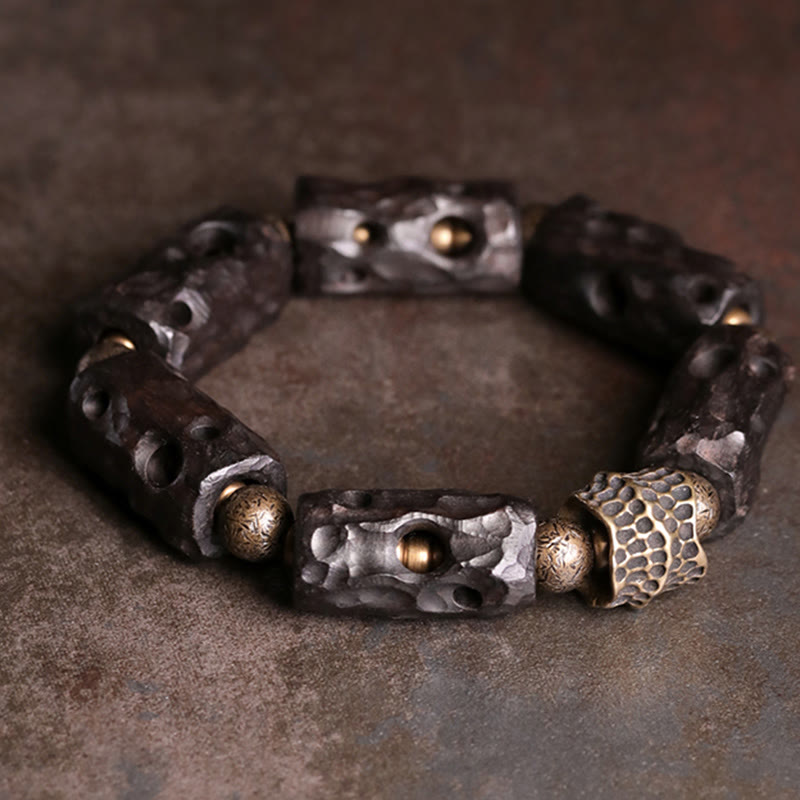 Pulsera de calma con Buddha Stones, madera de ébano, cobre y latón
