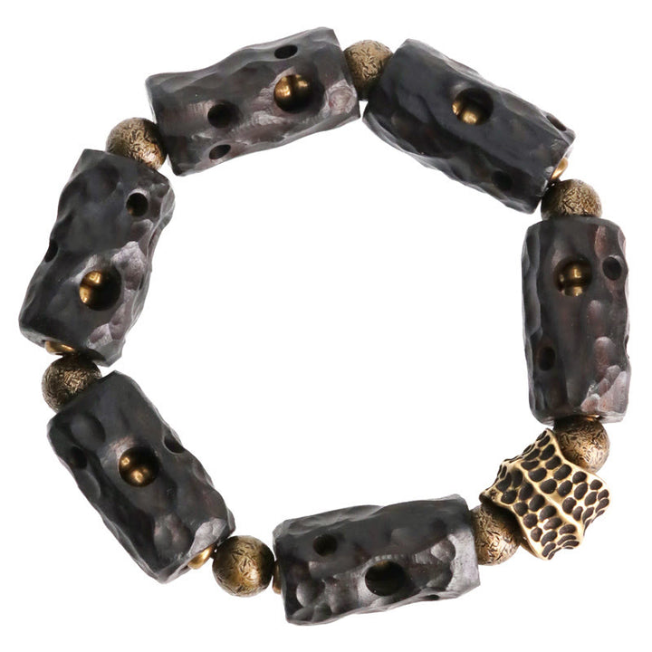 Pulsera de calma con Buddha Stones, madera de ébano, cobre y latón