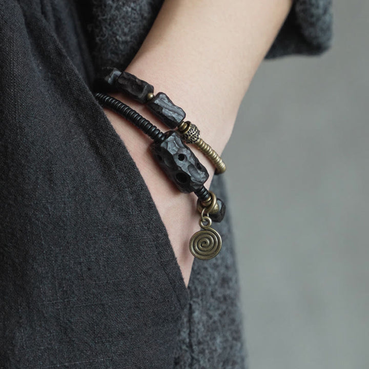 Pulsera de doble vuelta con Buddha Stones, madera de ébano, cobre, latón y ágata roja