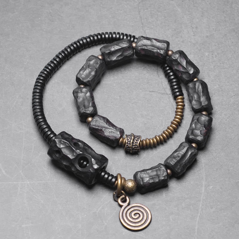Pulsera de doble vuelta con Buddha Stones, madera de ébano, cobre, latón y ágata roja