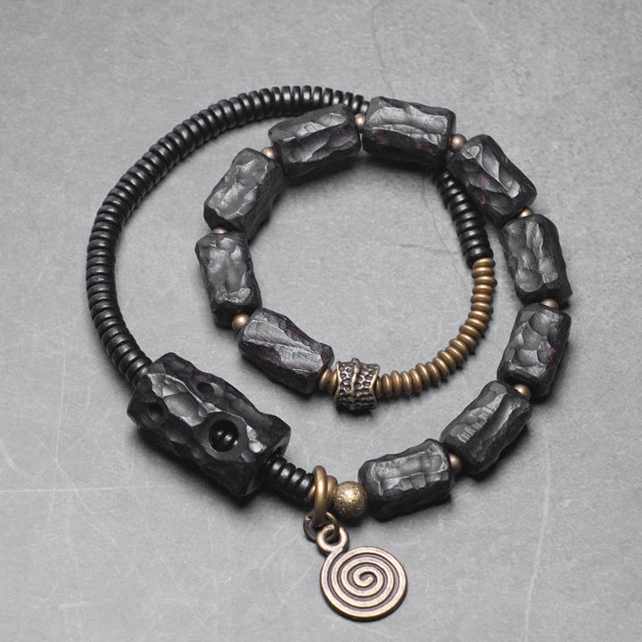 Pulsera de doble vuelta con Buddha Stones, madera de ébano, cobre, latón y ágata roja