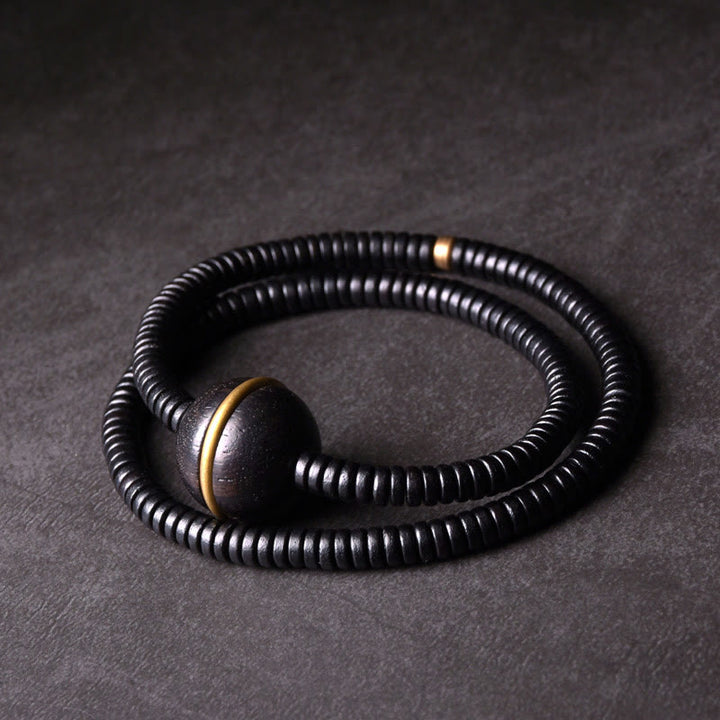 Pulsera de doble vuelta con forma de cubo y bola de equilibrio de latón, cobre y madera de ébano y Buddha Stones