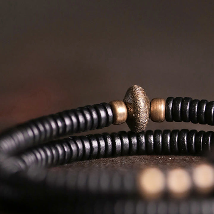 Pulsera de doble vuelta con Buddha Stones, madera de ébano, cobre y latón