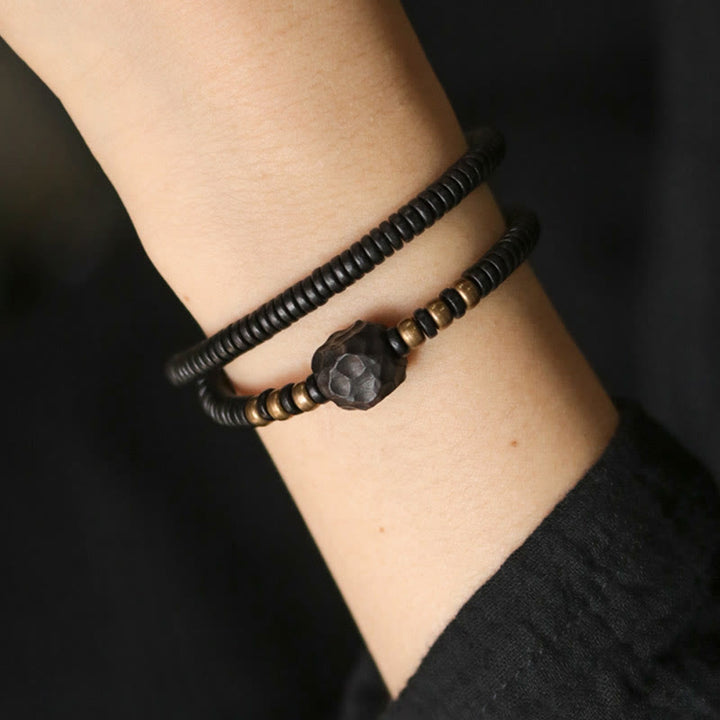 Pulsera de doble vuelta con Buddha Stones, madera de ébano, cobre y latón