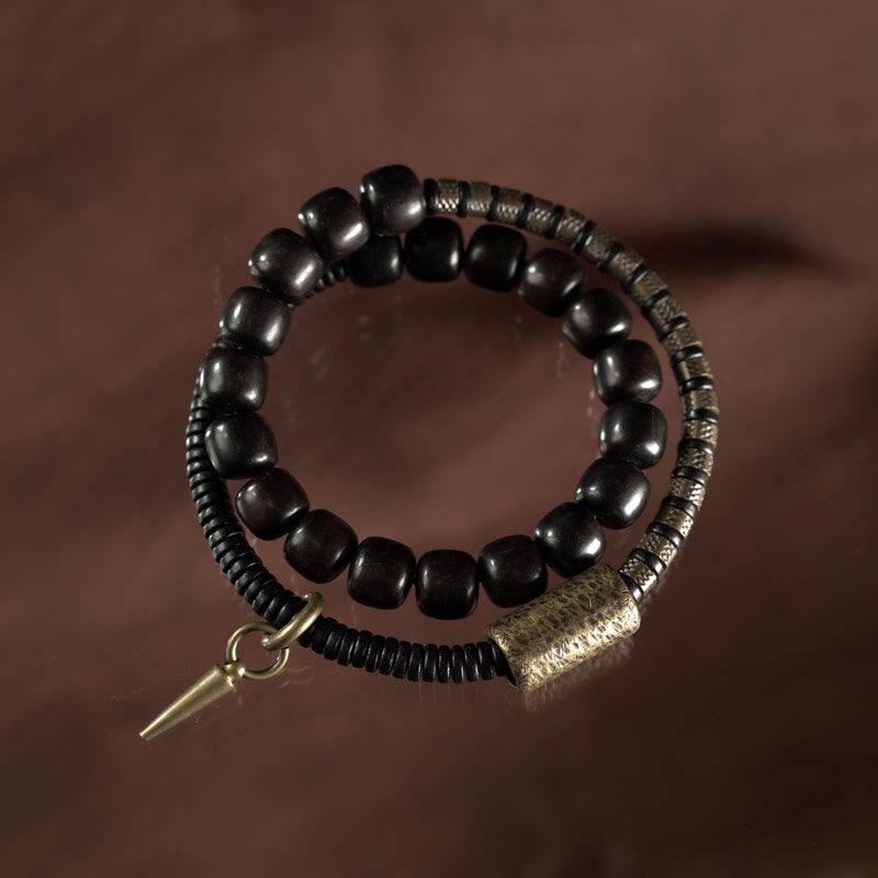 Pulsera de equilibrio de doble vuelta con cuentas cónicas vintage de madera de ébano, cobre y latón con Buddha Stones