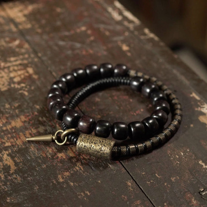 Pulsera de equilibrio de doble vuelta con cuentas cónicas vintage de madera de ébano, cobre y latón con Buddha Stones