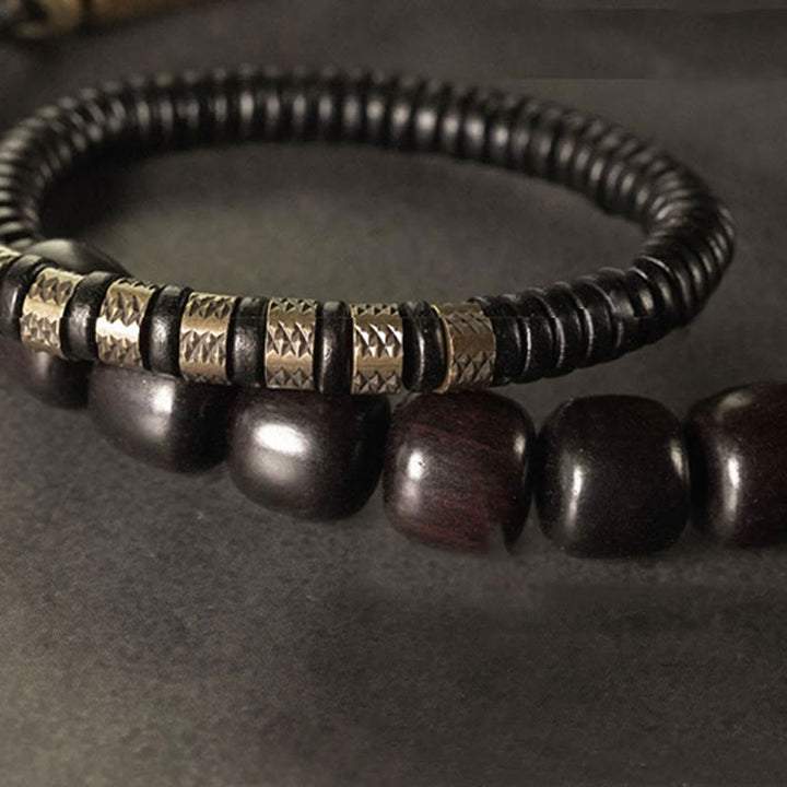 Pulsera de equilibrio de doble vuelta con cuentas cónicas vintage de madera de ébano, cobre y latón con Buddha Stones
