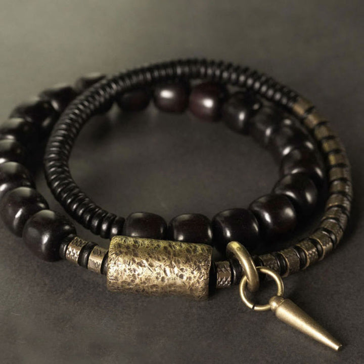 Pulsera de equilibrio de doble vuelta con cuentas cónicas vintage de madera de ébano, cobre y latón con Buddha Stones