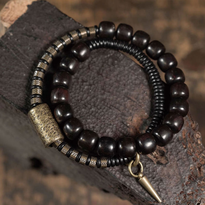 Pulsera de equilibrio de doble vuelta con cuentas cónicas vintage de madera de ébano, cobre y latón con Buddha Stones