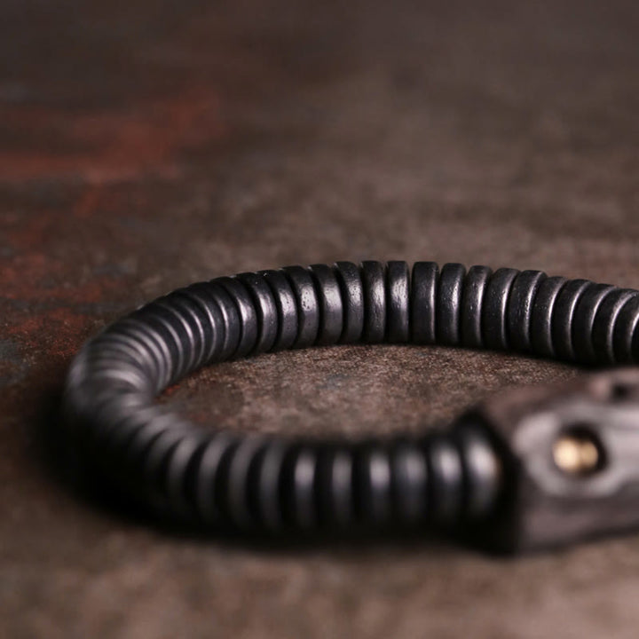 Pulsera de equilibrio perforada con Buddha Stones, madera de ébano, cobre y latón