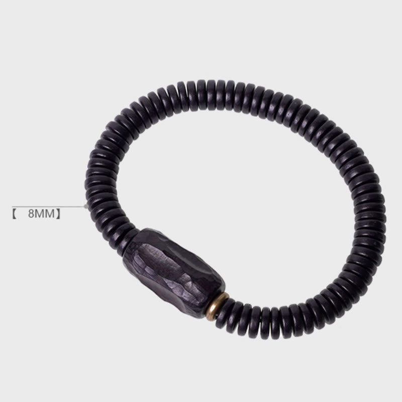 Pulsera de equilibrio perforada con Buddha Stones, madera de ébano, cobre y latón