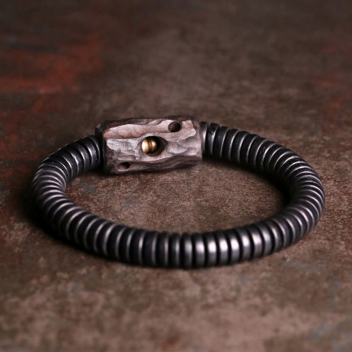 Pulsera de equilibrio perforada con Buddha Stones, madera de ébano, cobre y latón