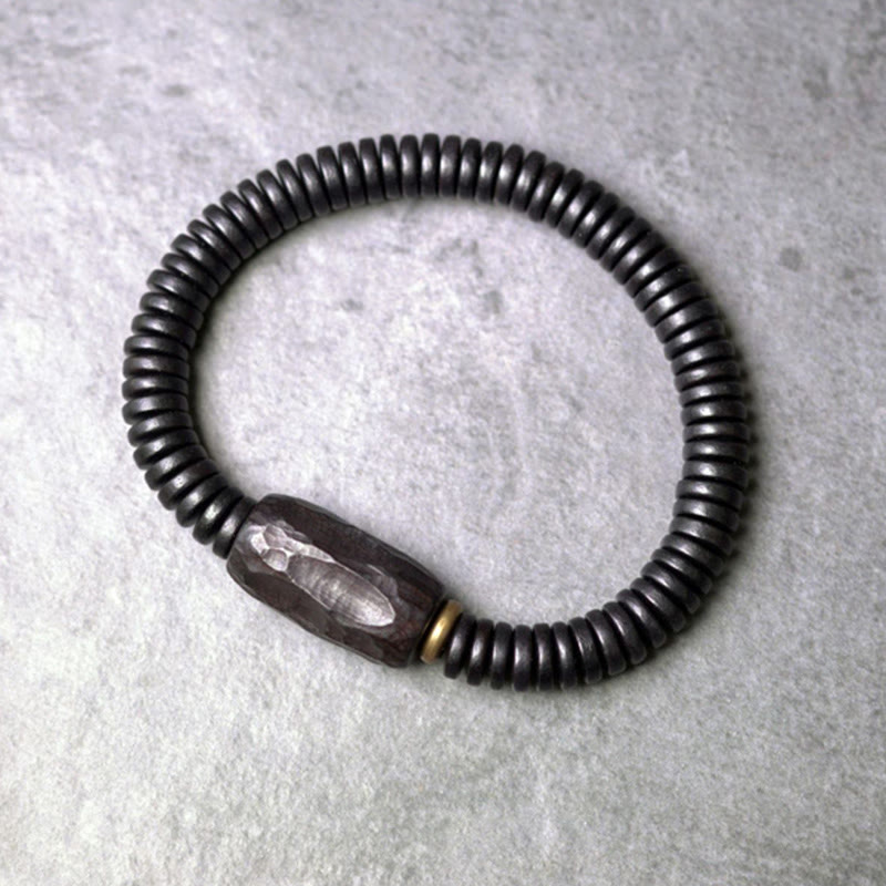 Pulsera de equilibrio perforada con Buddha Stones, madera de ébano, cobre y latón