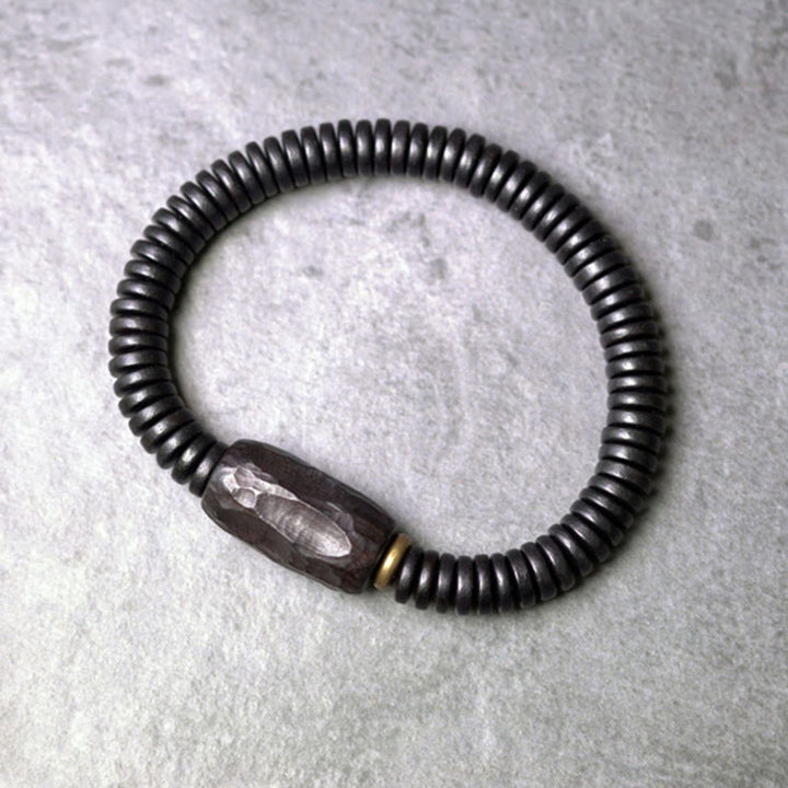 Pulsera de equilibrio perforada con Buddha Stones, madera de ébano, cobre y latón