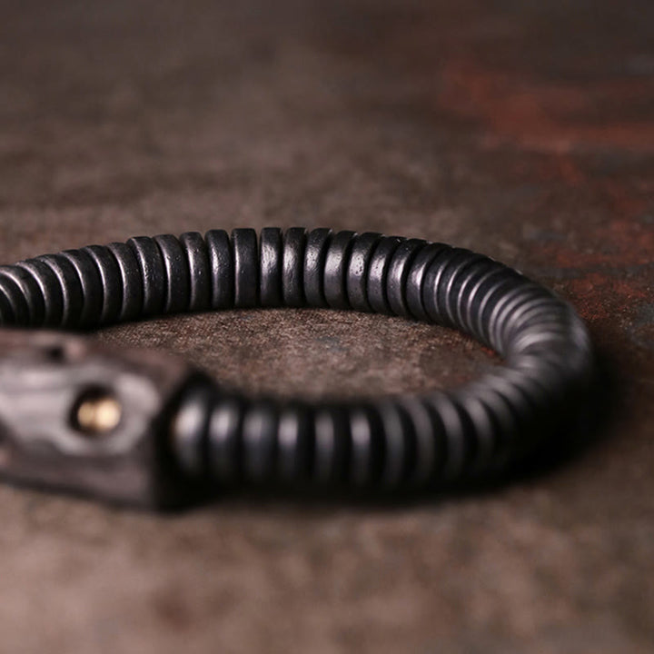 Pulsera de equilibrio perforada con Buddha Stones, madera de ébano, cobre y latón