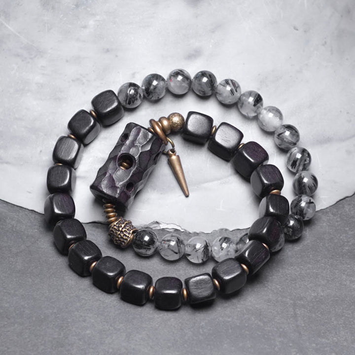 Pulsera de equilibrio de doble vuelta con Buddha Stones, madera de ébano, cuarzo rutilado negro, cobre y latón