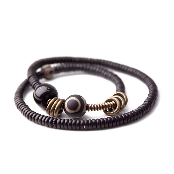 Pulsera de doble vuelta con cuentas Dzi de latón, cobre, sándalo verde, madera de ébano y Buddha Stones