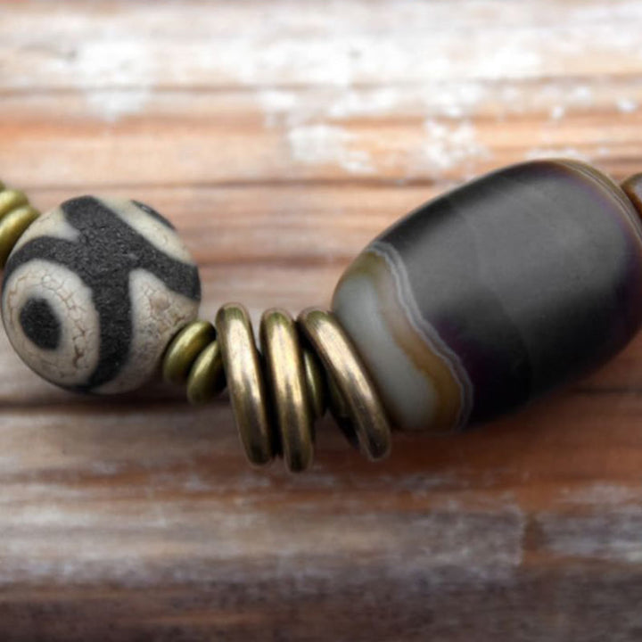 Pulsera de doble vuelta con cuentas Dzi de latón, cobre, sándalo verde, madera de ébano y Buddha Stones