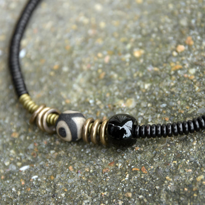 Pulsera de doble vuelta con cuentas Dzi de latón, cobre, sándalo verde, madera de ébano y Buddha Stones