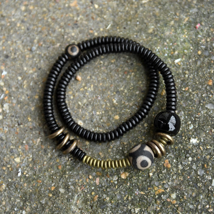 Pulsera de doble vuelta con cuentas Dzi de latón, cobre, sándalo verde, madera de ébano y Buddha Stones