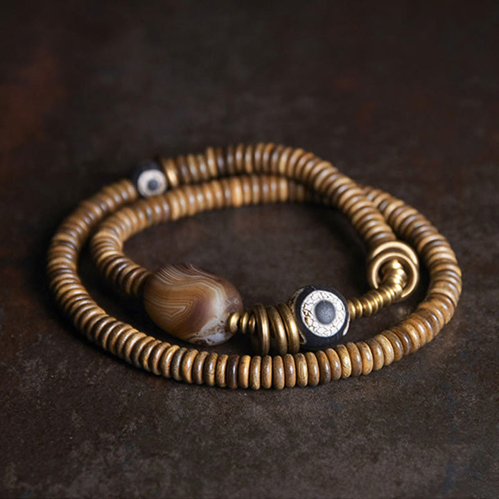 Pulsera de doble vuelta con cuentas Dzi de latón, cobre, sándalo verde, madera de ébano y Buddha Stones
