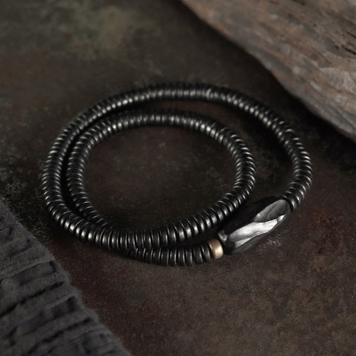 Pulsera de triple vuelta con Buddha Stones, madera de ébano, cobre y latón