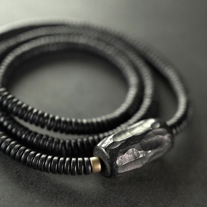 Pulsera de triple vuelta con Buddha Stones, madera de ébano, cobre y latón