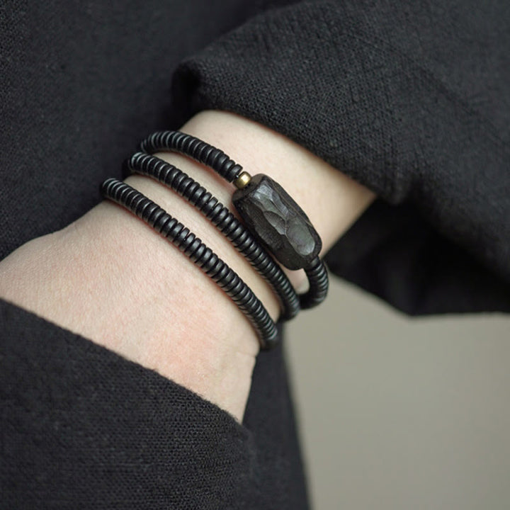 Pulsera de triple vuelta con Buddha Stones, madera de ébano, cobre y latón