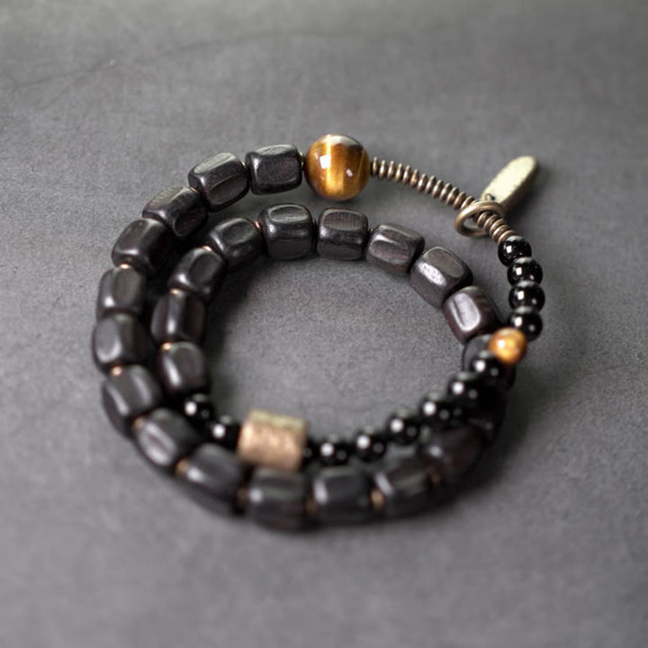 Pulsera de doble vuelta con Buddha Stones, madera de ébano, cobre, latón y ojo de tigre