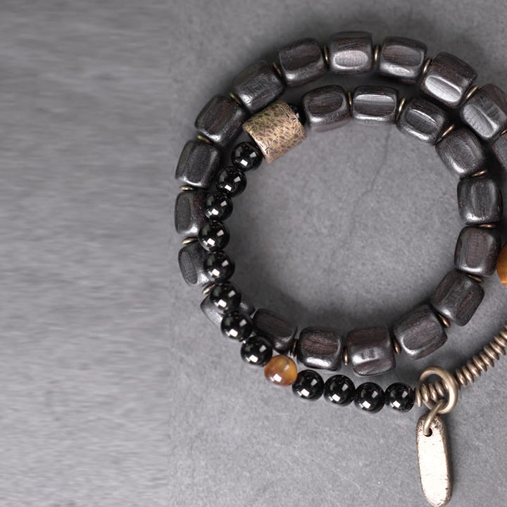 Pulsera de doble vuelta con Buddha Stones, madera de ébano, cobre, latón y ojo de tigre