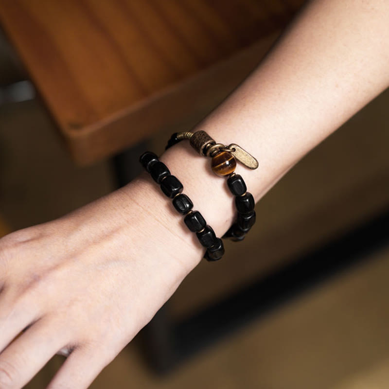 Pulsera de doble vuelta con Buddha Stones, madera de ébano, cobre, latón y ojo de tigre