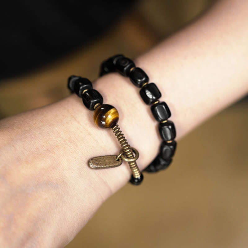 Pulsera de doble vuelta con Buddha Stones, madera de ébano, cobre, latón y ojo de tigre