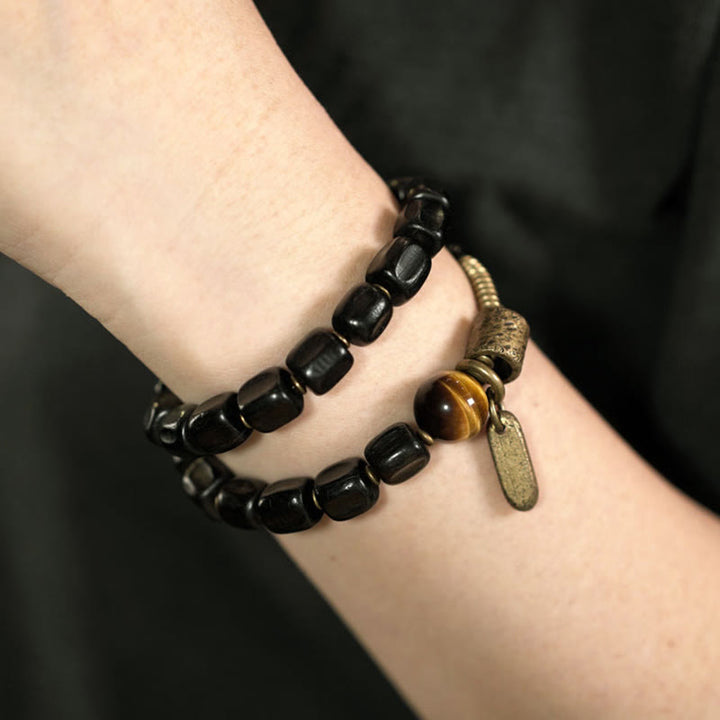Pulsera de doble vuelta con Buddha Stones, madera de ébano, cobre, latón y ojo de tigre