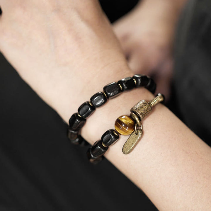 Pulsera de doble vuelta con Buddha Stones, madera de ébano, cobre, latón y ojo de tigre