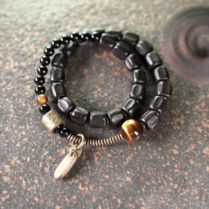 Pulsera de doble vuelta con Buddha Stones, madera de ébano, cobre, latón y ojo de tigre