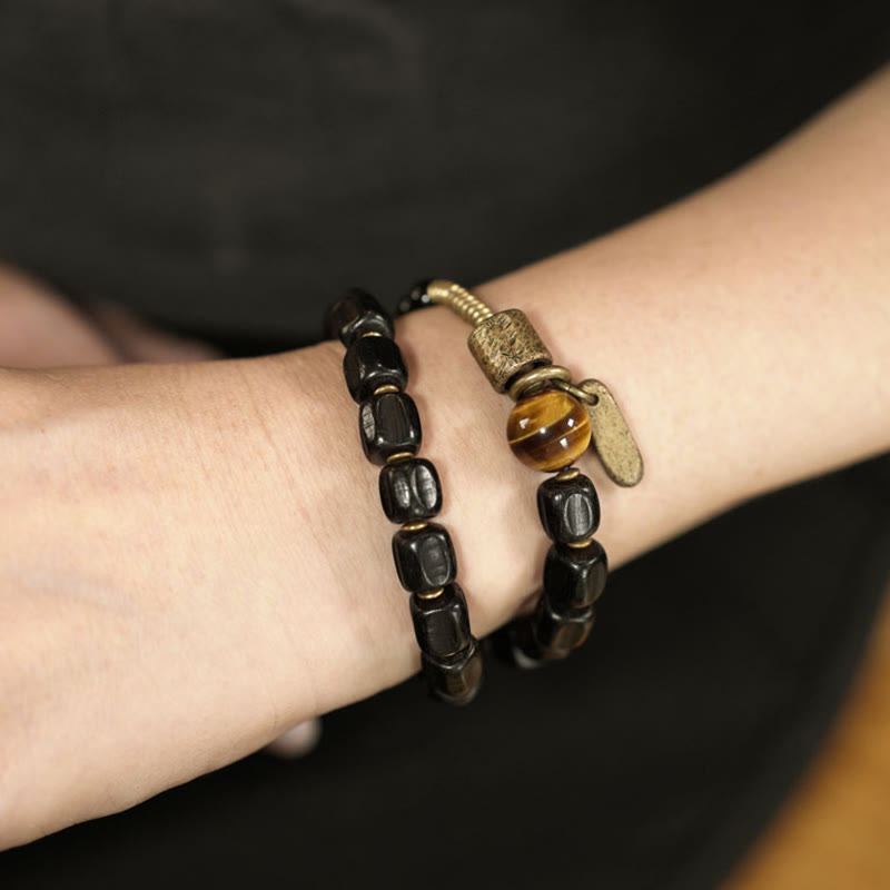 Pulsera de doble vuelta con Buddha Stones, madera de ébano, cobre, latón y ojo de tigre