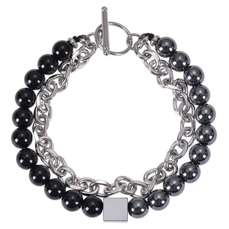 Pulsera de protección de doble envoltura de acero y titanio con magnetita negra y piedra esmerilada de ojo de tigre de colores de Buddha Stones