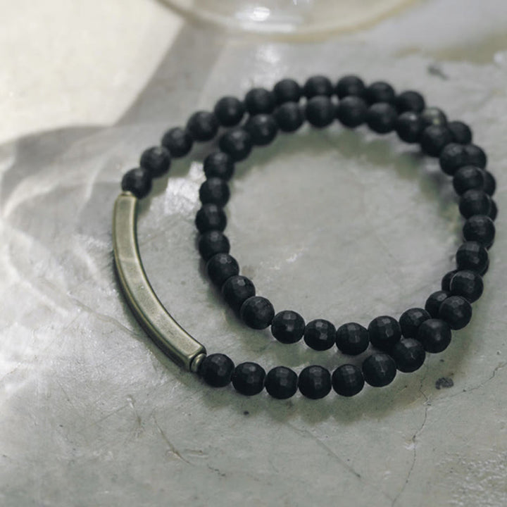 Pulsera protectora de doble vuelta con Buddha Stones, superficie cortada esmerilada, ónix negro, cobre y latón
