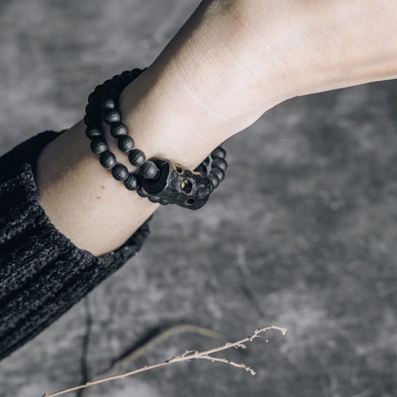 Pulsera protectora de doble vuelta con ónix negro y ébano con superficie de corte esmerilado y Buddha Stones