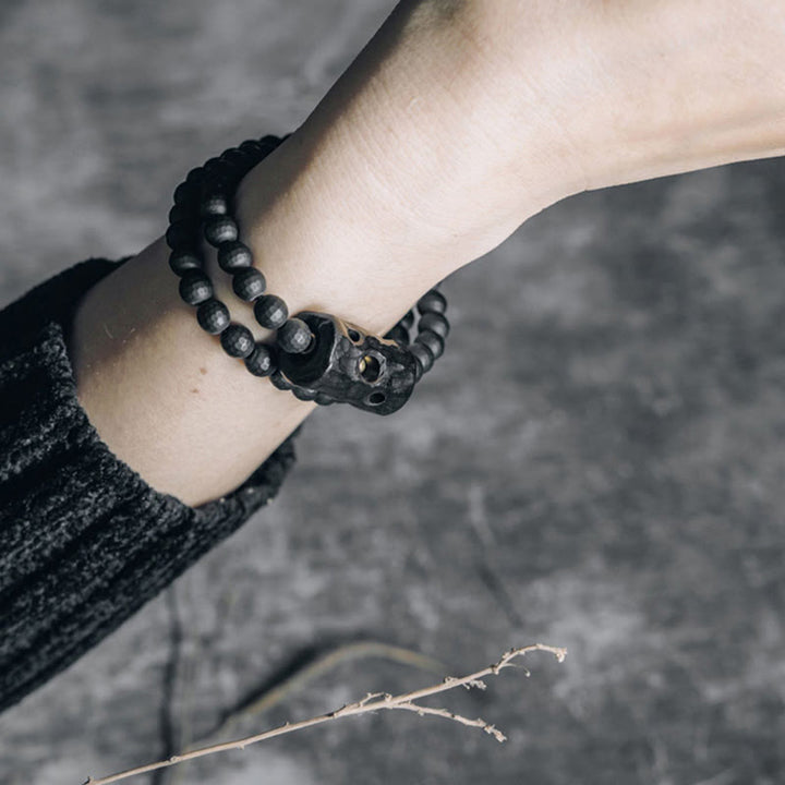 Pulsera protectora de doble vuelta con ónix negro y ébano con superficie de corte esmerilado y Buddha Stones