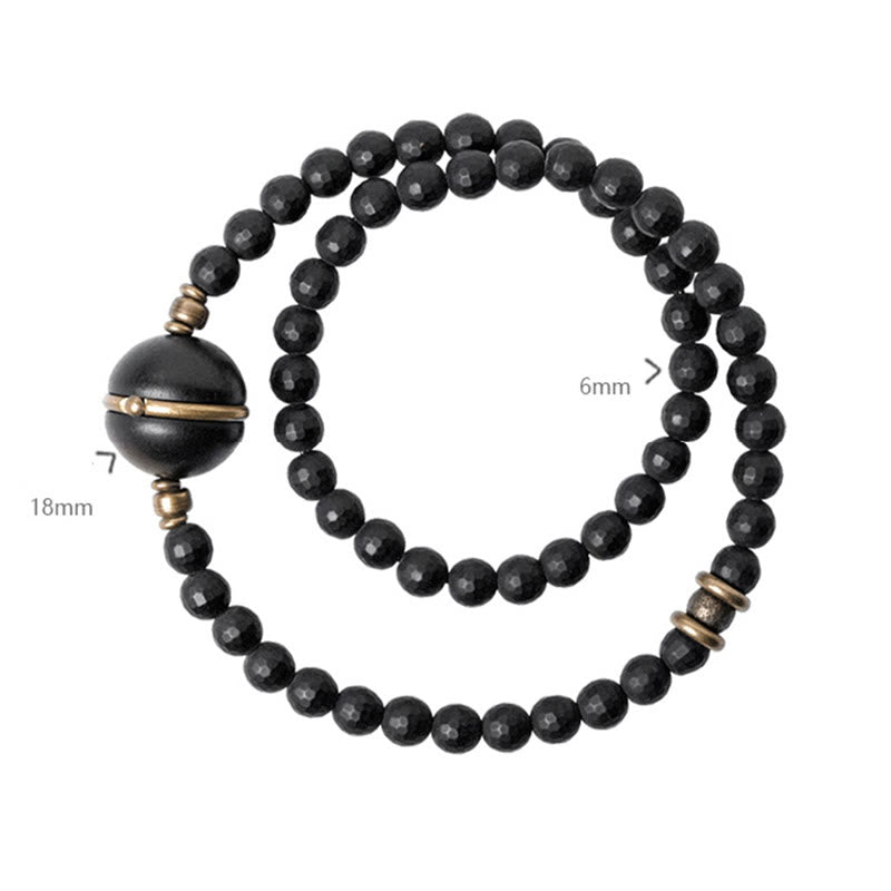 Pulsera protectora de doble envoltura con cuentas de ébano y ónix negro con superficie cortada esmerilada y Buddha Stones