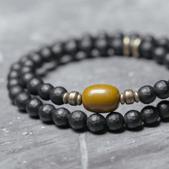 Pulsera protectora de doble envoltura con cuentas de topacio ónix negro y superficie cortada esmerilada con Buddha Stones
