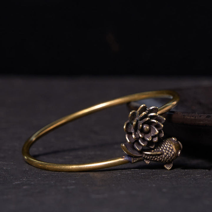 Pulsera de cobre y latón con Buddha Stones , flor de loto, pez koi y iluminación