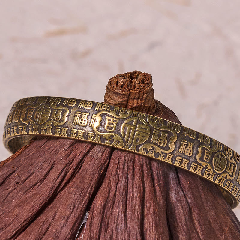 Pulsera de cobre y latón con símbolo de la suerte de Buddha Stones de las cien bendiciones