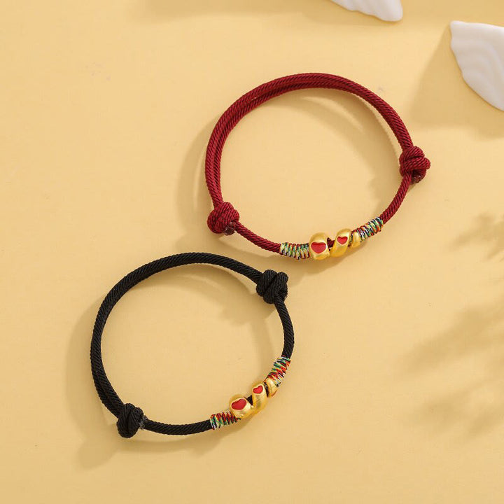 Pulsera trenzada de protección del año de la serpiente con hilo rojo y aleación de cobre y Buddha Stones