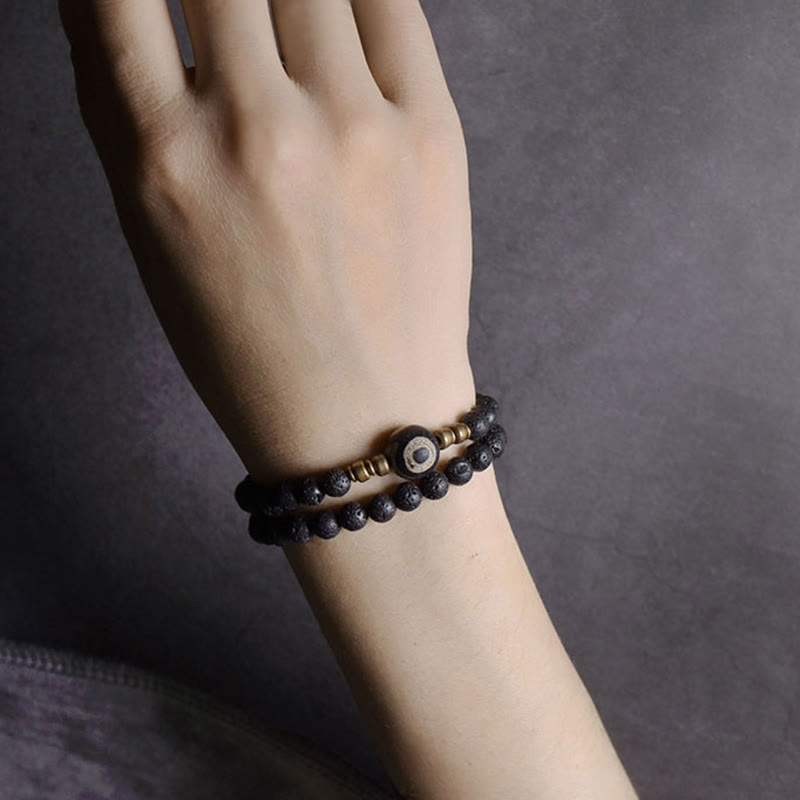 Pulsera curativa de doble vuelta con cuentas de latón y cobre de tres ojos de piedra de lava vintage de Buddha Stones